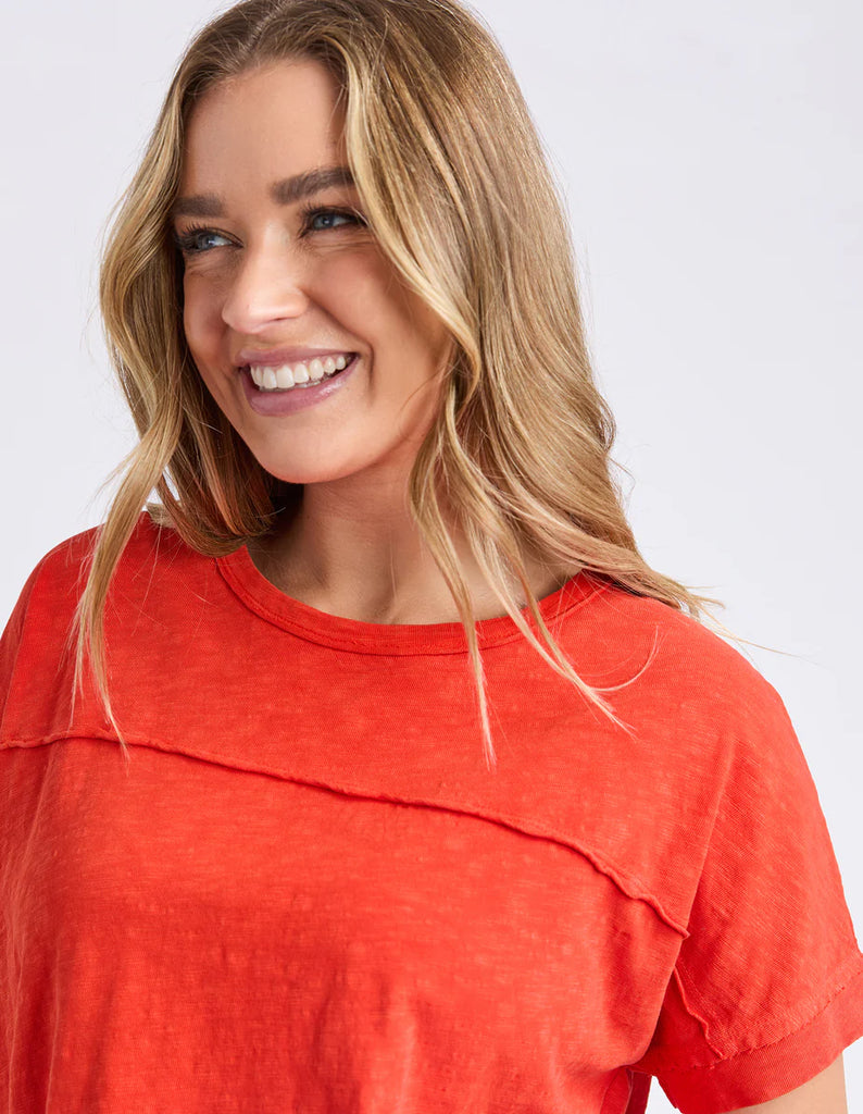 Allison tee - tangelo-Foxwood-Stay vibrant and fresh in the Allison Tee! Made from 100% cotton, this tee will keep you comfortable and stylish all day long whilst adding a pop of colour to your wardrobe. Keep it fun with the Allison Tee! Round neckline Design lines Raw edge details 100% Cotton Our model is 176cm and wears Size 10-Pash + Evolve