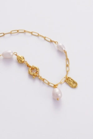 Amara Necklace - Gold-Zarla-A refined chain necklace detailed with soft pearls and textured accents. Light-catching and layered, it brings an effortless, ocean-inspired feel to your look. Feminine, elevated, and designed for everyday wear. *18K Gold Plated Solid Brass Base *Water proof: Can be worn in the ocean or pool-Pash + Evolve