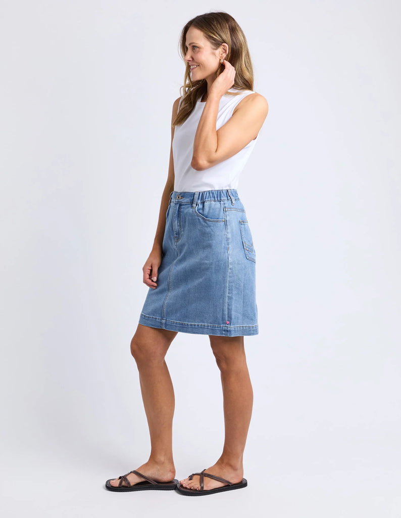 Birdie Denim Skirt - Light Blue Wash-Elm-The Birdie Denim Skirt brings playful charm with its comfy elastic at the side seams and back waist, giving you the perfect fit every time. Its knee-length cut is easygoing and flattering, while the Elm-stamped hardware adds a fun, unique touch to this effortlessly stylish skirt. Elastic at side seams and back waist Elm stamped hardware Flattering knee length 99% cotton 1% elastane stretch denim Model is 171cm and wears Size 10-Pash + Evolve