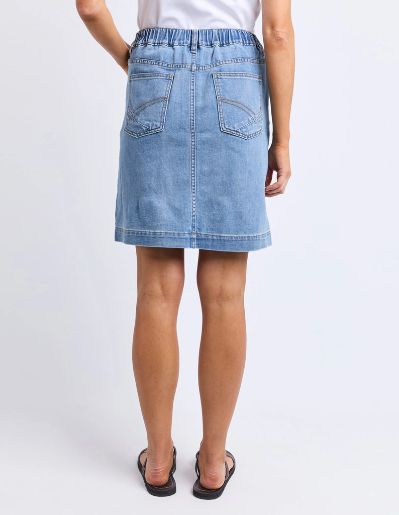 Birdie Denim Skirt - Light Blue Wash-Elm-The Birdie Denim Skirt brings playful charm with its comfy elastic at the side seams and back waist, giving you the perfect fit every time. Its knee-length cut is easygoing and flattering, while the Elm-stamped hardware adds a fun, unique touch to this effortlessly stylish skirt. Elastic at side seams and back waist Elm stamped hardware Flattering knee length 99% cotton 1% elastane stretch denim Model is 171cm and wears Size 10-Pash + Evolve