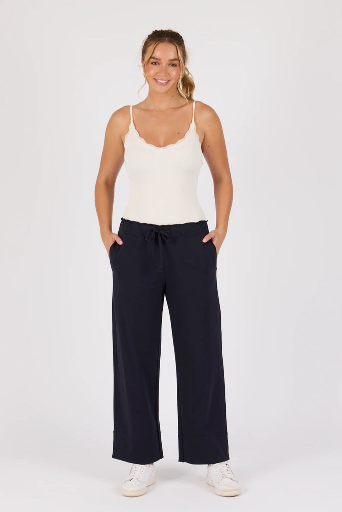 Cuff Detail Pant - Blue Graphite-One Ten Willow-Elasticated Waist Band Self Fabric Waist Tie Side Pockets Wide Leg Cuff Detail Material: 95% Cotton 5% Elastane Model is 176cm (Size 8-10) and wears our size Small-Pash + Evolve