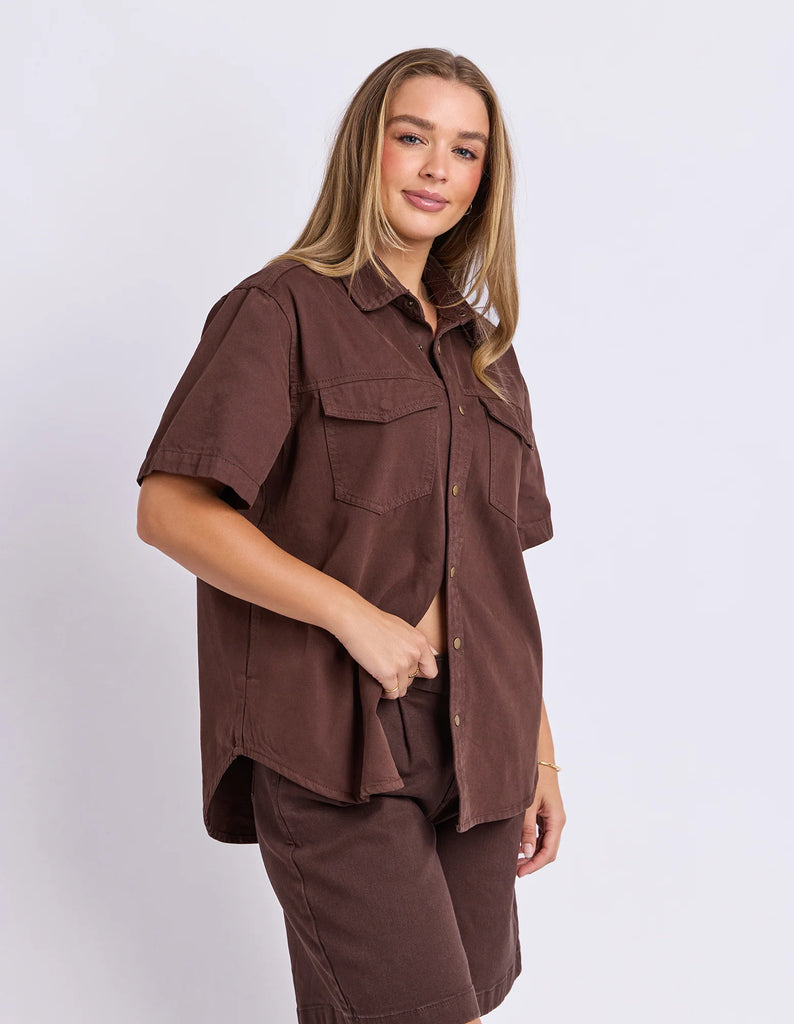 Daisy Short Sleeve Shirt - Chocolate-Foxwood-Your favourite denim shirt just got cooler with short sleeves. Featuring a button-through placket, front chest pockets, and a relaxed fit, the Daisy SS Shirt is perfect for easygoing days with laid-back style. Button through placket Front chest pockets Relaxed fit Model is wearing a size 10-Pash + Evolve