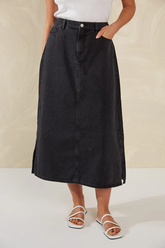 Dalton Denim Skirt - Slate-HAVEN-Meet your new go-to denim piece, the Dalton Denim Skirt, crafted from stretchy cotton. This midi skirt, flaunting an A-line silhouette, seamlessly incorporates features from your favourite denim jeans. An ideal alternative to traditional jeans, it's the perfect companion for casual occasions and weekend activities. A-Line Mid-rise Half elastic waist Button and zip closure Belt loops Front and back pockets Wide vents Midi-length 98% Cotton, 2% Spandex-Pash + Evolve
