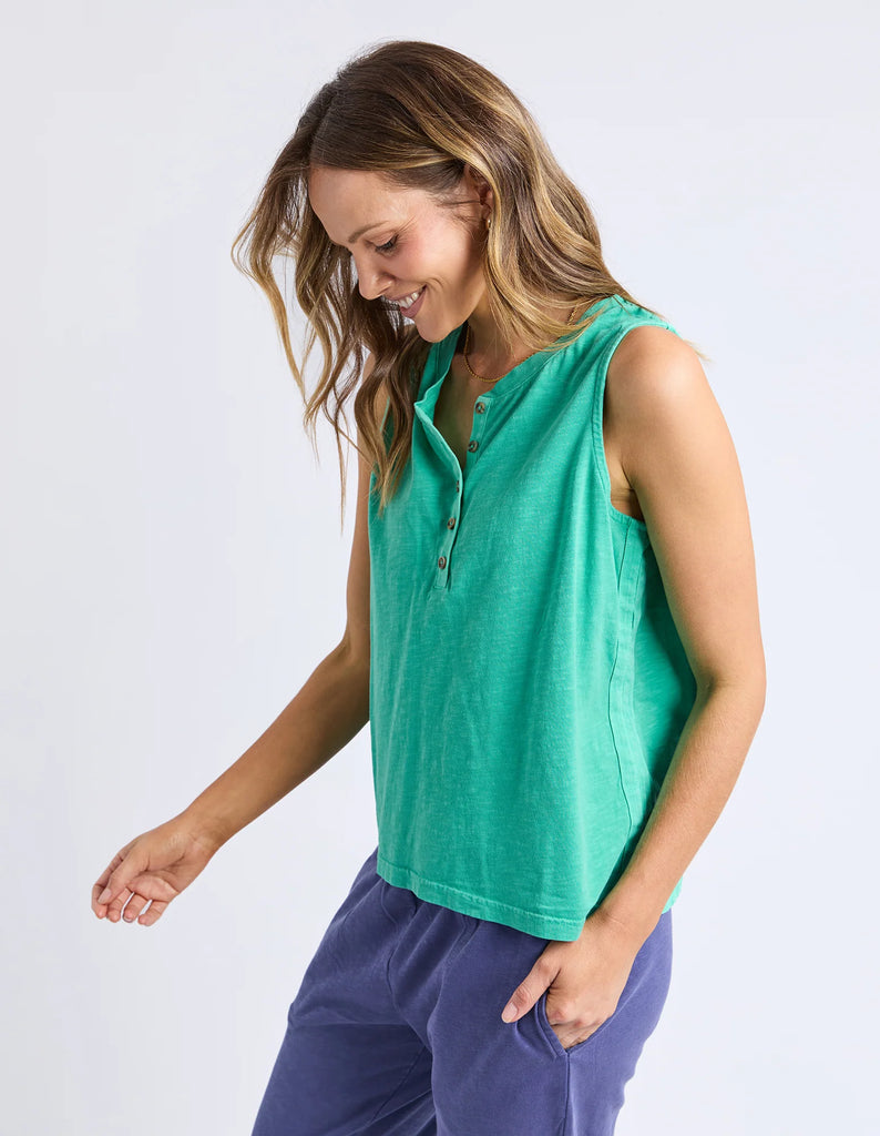 Elysian tank - gumdrop green-Elm-The Elysian Tank features a sleek button placket on the front for adjustable styling and added detail. Woven tape along the side seams enhances the tank's structure, creating a polished look while maintaining comfort. This versatile piece effortlessly elevates casual and layered outfits alike. Button placket Wide straps for bra coverage Woven tape down side seams 100% Cotton Slub Jersey Model is 171cm and wears Size 10-Pash + Evolve