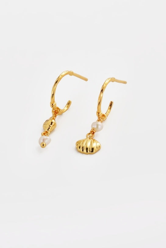 Goldie Hoop - Gold-Zarla-A refined hoop finished with delicate charms and soft pearl accents. Light-catching and fluid, it brings a warm, sunlit feel with a subtle coastal edge. Effortless, feminine, and designed for everyday wear. *18K Gold Plated Solid Brass Base *Water proof: Can be worn in the ocean or pool-Pash + Evolve