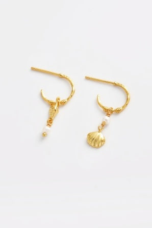 Goldie Hoop - Gold-Zarla-A refined hoop finished with delicate charms and soft pearl accents. Light-catching and fluid, it brings a warm, sunlit feel with a subtle coastal edge. Effortless, feminine, and designed for everyday wear. *18K Gold Plated Solid Brass Base *Water proof: Can be worn in the ocean or pool-Pash + Evolve
