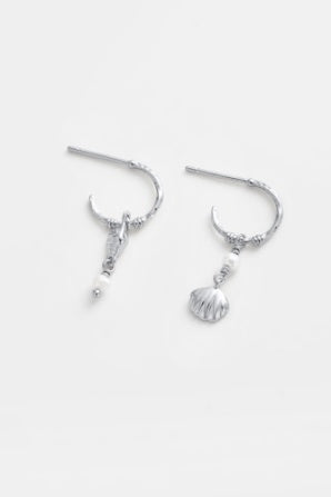 Goldie hoop - silver-Zarla-A refined hoop finished with delicate charms and soft pearl accents. Light-catching and fluid, it brings a cool, luminous feel with a subtle coastal edge. Effortless, feminine, and designed for everyday wear. *Rhodium Plated Solid Brass Base *Water proof: Can be worn in the ocean or pool-Pash + Evolve