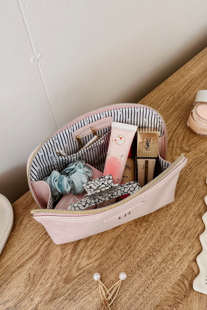 Greta Makeup Bag - Baby Pink-Louenhide-The Louenhide Greta Baby Pink Makeup Bag will take your beauty routine to the next level! As pretty as it is practical, choose your favourite shade and let your personality shine through. Crafted from a lightweight and soft to touch material, this travel makeup pouch is easy to carry and perfect for tossing into your carry-on or beach bag. Featuring a small open compartment that's the right size for your essentials, this women's toiletry bag ensures you find exactly wh