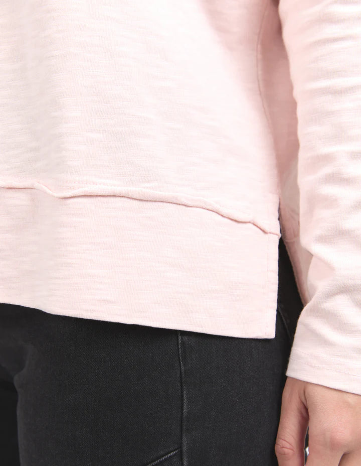 Jayne Throw On Top - Pale Pink-Foxwood-The Jayne Throw on Top is the perfect lightweight long sleeve to take you through the seasons. Cut from a comfy, cotton slub jersey this women's top features a crew neck, trendy exposed stitching and side split hi-low hem. Seriously versatile we know you'll be wearing this on repeat. Round neckline Design lines Raw edge details 100% Cotton Our model is 176cm and wears Size 10-Pash + Evolve