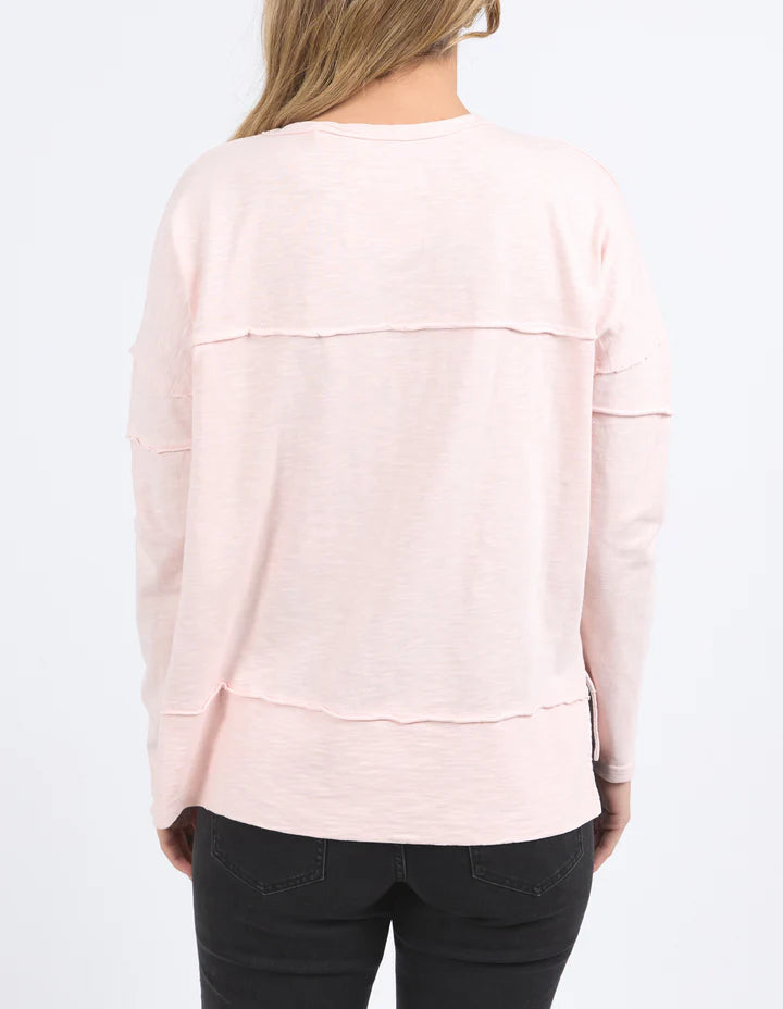 Jayne Throw On Top - Pale Pink-Foxwood-The Jayne Throw on Top is the perfect lightweight long sleeve to take you through the seasons. Cut from a comfy, cotton slub jersey this women's top features a crew neck, trendy exposed stitching and side split hi-low hem. Seriously versatile we know you'll be wearing this on repeat. Round neckline Design lines Raw edge details 100% Cotton Our model is 176cm and wears Size 10-Pash + Evolve