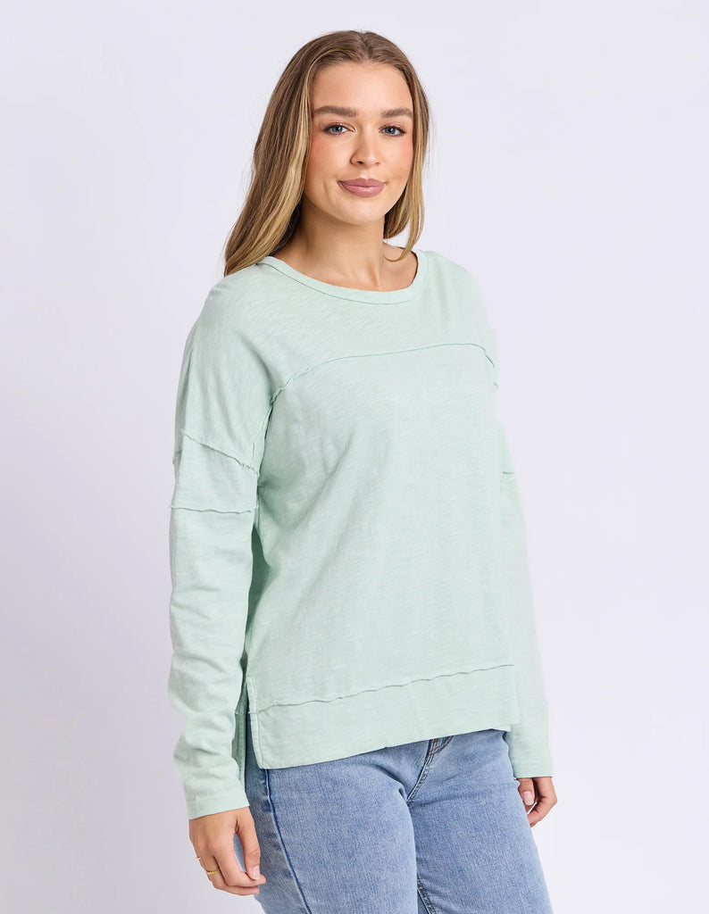 Jayne Throw On Top - Subdued Mint-Foxwood-The Jayne Throw on Top is the perfect lightweight long sleeve to take you through the seasons. Cut from a comfy, cotton slub jersey this women's top features a crew neck, trendy exposed stitching and side split hi-low hem. Seriously versatile we know you'll be wearing this on repeat. Round neckline Design lines Raw edge details 100% Cotton Model is wearing a size 10 Our model is 176cm and wears Size 10-Pash + Evolve