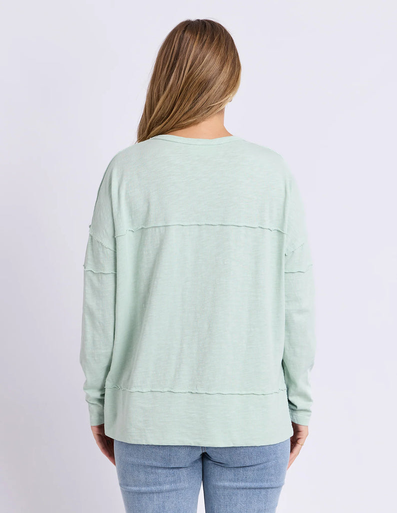 Jayne Throw On Top - Subdued Mint-Foxwood-The Jayne Throw on Top is the perfect lightweight long sleeve to take you through the seasons. Cut from a comfy, cotton slub jersey this women's top features a crew neck, trendy exposed stitching and side split hi-low hem. Seriously versatile we know you'll be wearing this on repeat. Round neckline Design lines Raw edge details 100% Cotton Model is wearing a size 10 Our model is 176cm and wears Size 10-Pash + Evolve