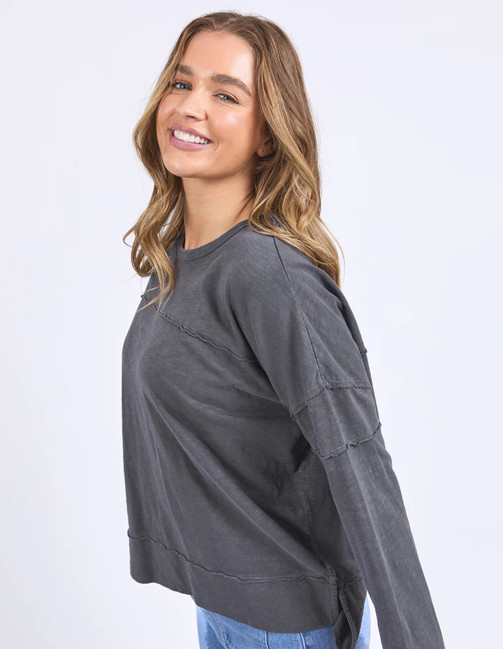 Jayne throw on top - charcoal-Foxwood-The Jayne Throw on Top is the perfect lightweight long sleeve to take you through the seasons. Cut from a comfy, cotton slub jersey this women's top features a crew neck, trendy exposed stitching and side split hi-low hem. Seriously versatile we know you'll be wearing this on repeat. Round neckline Design lines Raw edge details 100% Cotton Model is wearing a size 10-Pash + Evolve