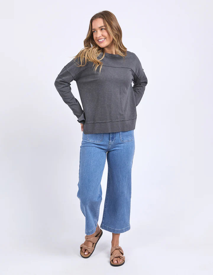 Jayne throw on top - charcoal-Foxwood-The Jayne Throw on Top is the perfect lightweight long sleeve to take you through the seasons. Cut from a comfy, cotton slub jersey this women's top features a crew neck, trendy exposed stitching and side split hi-low hem. Seriously versatile we know you'll be wearing this on repeat. Round neckline Design lines Raw edge details 100% Cotton Model is wearing a size 10-Pash + Evolve