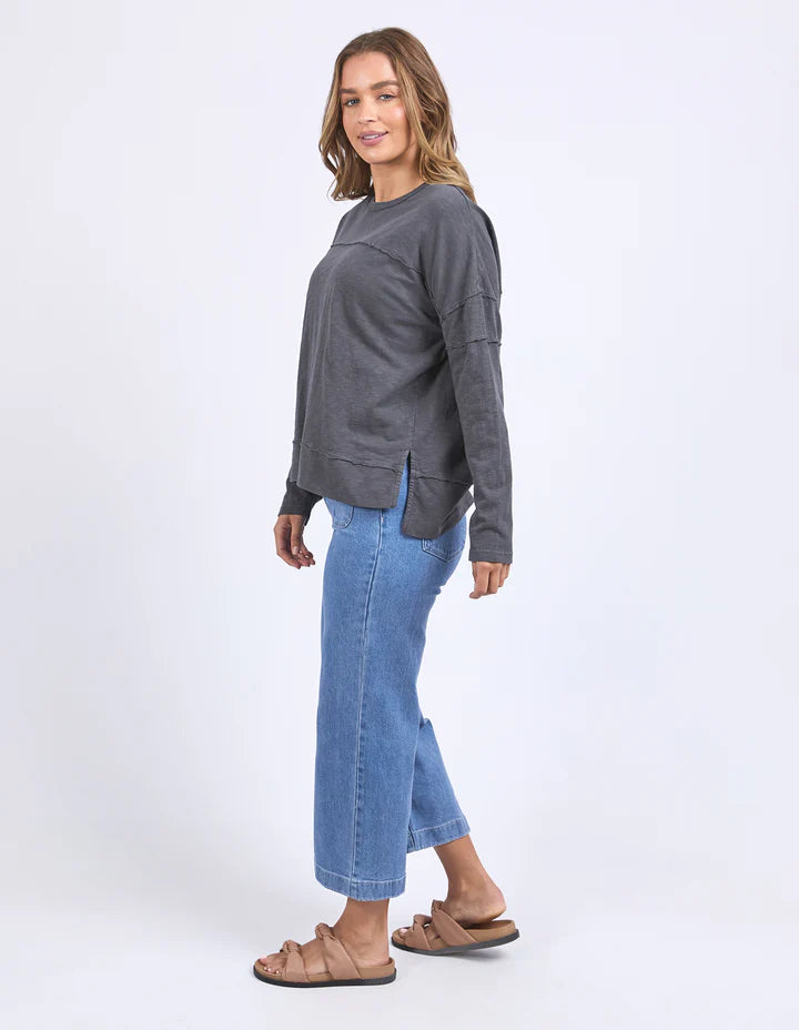 Jayne throw on top - charcoal-Foxwood-The Jayne Throw on Top is the perfect lightweight long sleeve to take you through the seasons. Cut from a comfy, cotton slub jersey this women's top features a crew neck, trendy exposed stitching and side split hi-low hem. Seriously versatile we know you'll be wearing this on repeat. Round neckline Design lines Raw edge details 100% Cotton Model is wearing a size 10-Pash + Evolve