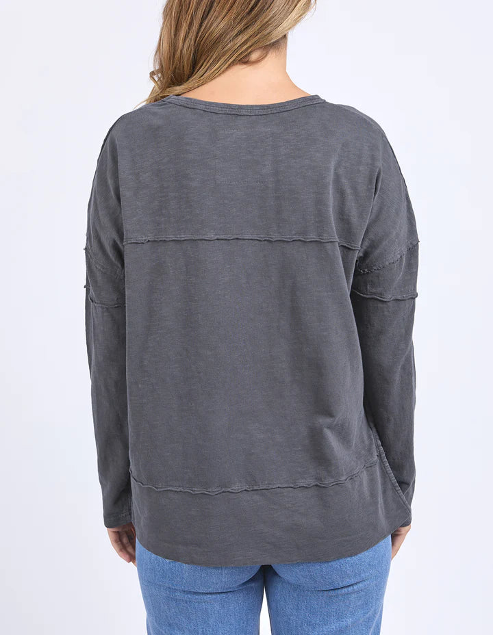 Jayne throw on top - charcoal-Foxwood-The Jayne Throw on Top is the perfect lightweight long sleeve to take you through the seasons. Cut from a comfy, cotton slub jersey this women's top features a crew neck, trendy exposed stitching and side split hi-low hem. Seriously versatile we know you'll be wearing this on repeat. Round neckline Design lines Raw edge details 100% Cotton Model is wearing a size 10-Pash + Evolve