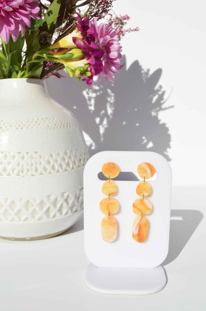 Juno earrings - sunset-Hagen + Co-A contemporary earring with drops of organic shapes in a beautiful sunset amber coloured marble acrylic. So sleek and timeless. *Materials: Acrylic*Nickel Free earring posts *Light weight and easy to wear. *Earring: 16mm x 65mm *Packaged in a gift box-Pash + Evolve