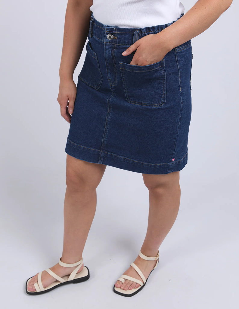 Lennox Denim Skirt - Dark Blue Wash-Elm-Redefine comfort and chic with the Lennox Denim Skirt, featuring the comfort of an elastic waistband and the style of patch pockets this is an easy wear stylish denim skirt. Elastic around side seams and back waist Self fabric front patch pockets Elm stamped hardware Stretch Denim Model is 171cm and wears Size 10-Pash + Evolve