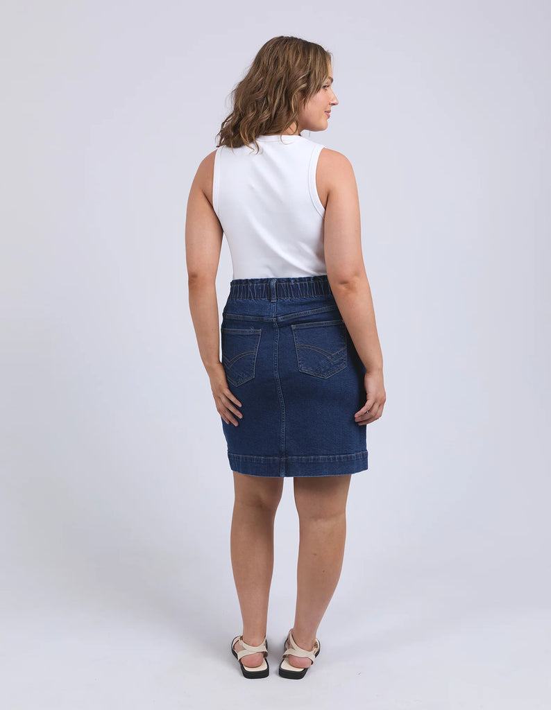 Lennox Denim Skirt - Dark Blue Wash-Elm-Redefine comfort and chic with the Lennox Denim Skirt, featuring the comfort of an elastic waistband and the style of patch pockets this is an easy wear stylish denim skirt. Elastic around side seams and back waist Self fabric front patch pockets Elm stamped hardware Stretch Denim Model is 171cm and wears Size 10-Pash + Evolve