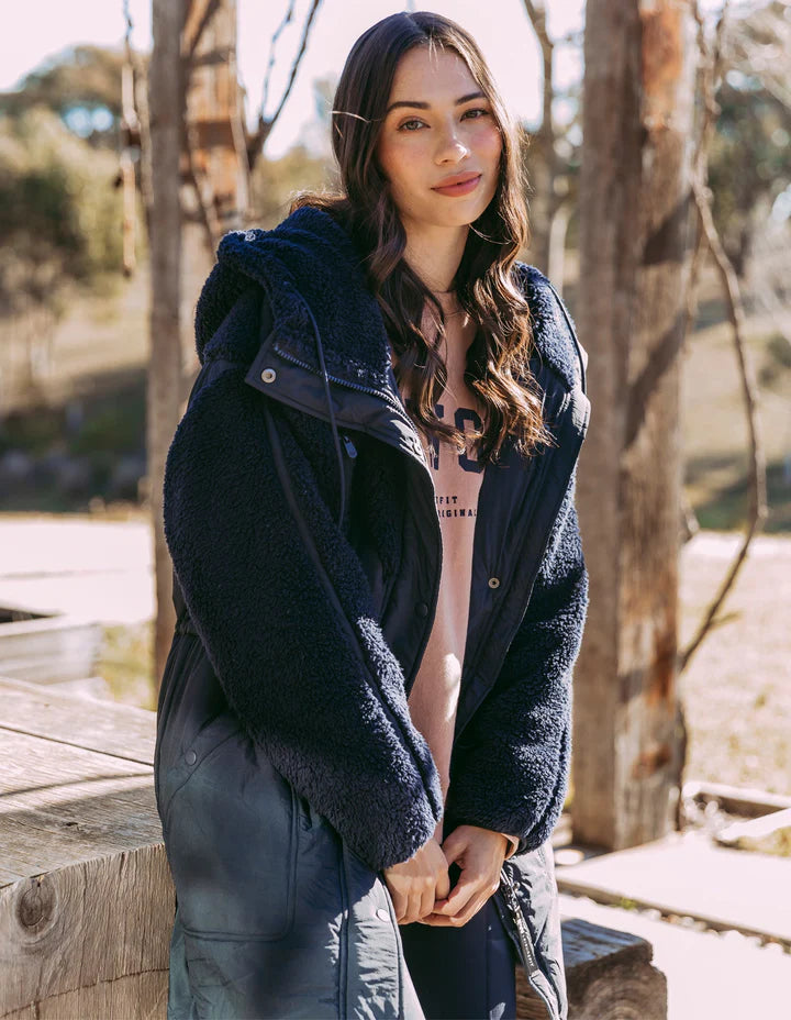 Longline Anorak - Navy-Foxwood-Be sure to stay snuggly warm on those cold days in the LeisureFit Longline Anorak. Featuring a zip and button opening for extra warmth, along with an elastic waist for flattering comfort this is the only layer you'll need this season. Front zip and button opening Contrast teddy fleece panels Elastic waist 100% Nylon Lining: 100% Polyester Model is wearing a size 10-Pash + Evolve