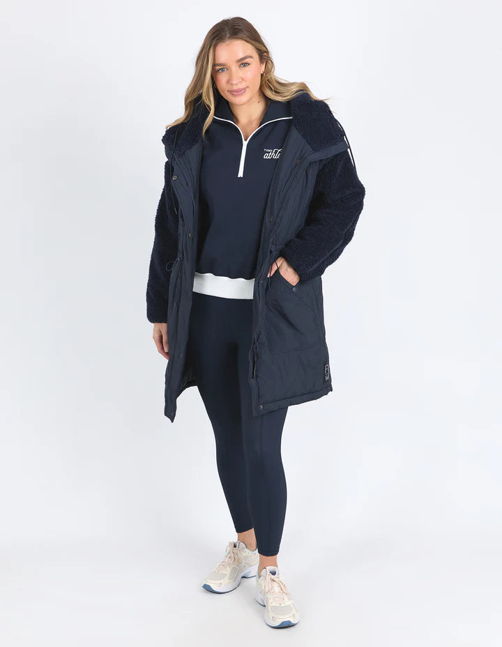 Longline Anorak - Navy-Foxwood-Be sure to stay snuggly warm on those cold days in the LeisureFit Longline Anorak. Featuring a zip and button opening for extra warmth, along with an elastic waist for flattering comfort this is the only layer you'll need this season. Front zip and button opening Contrast teddy fleece panels Elastic waist 100% Nylon Lining: 100% Polyester Model is wearing a size 10-Pash + Evolve