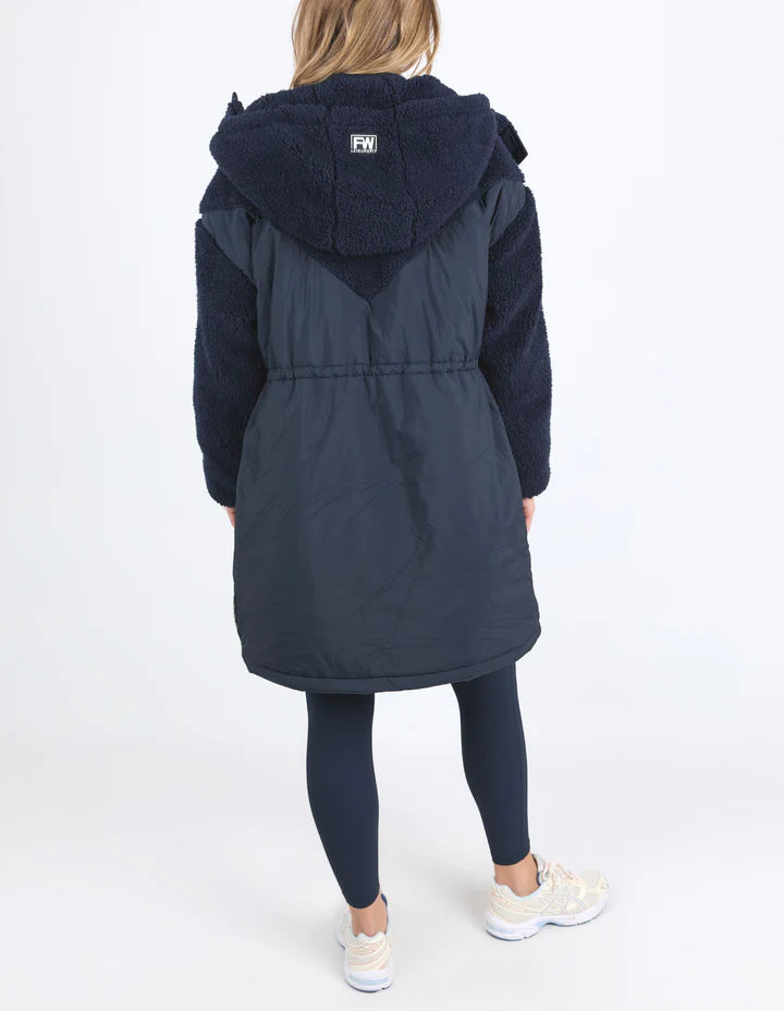 Longline Anorak - Navy-Foxwood-Be sure to stay snuggly warm on those cold days in the LeisureFit Longline Anorak. Featuring a zip and button opening for extra warmth, along with an elastic waist for flattering comfort this is the only layer you'll need this season. Front zip and button opening Contrast teddy fleece panels Elastic waist 100% Nylon Lining: 100% Polyester Model is wearing a size 10-Pash + Evolve