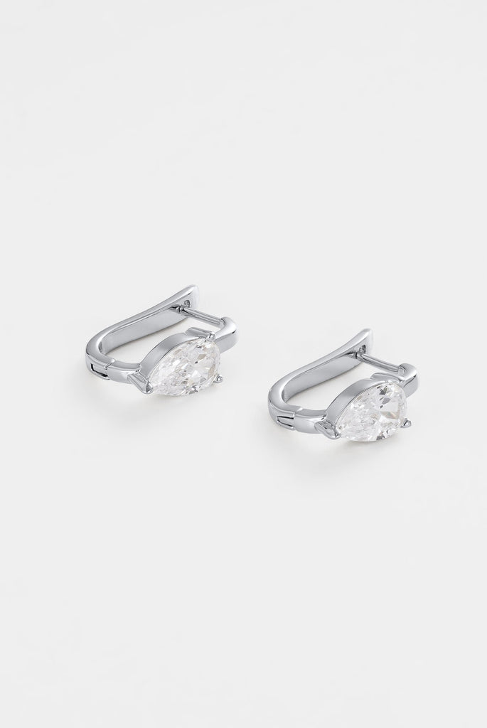 Lulu earring - silver-Zafino-The Lulu Earring is a modern take on a classic hoop, featuring a sleek rectangular silhouette finished with a pear-cut CZ stone for added brilliance. These silver earrings offer a clean, polished look while still delivering subtle statement appeal. Style them on their own for a refined finish or layer with other earrings for an elevated ear stack. Metal: Silver Plated on Brass baseDimensions: 13mm outer diameter, 8.3mm inner diameter + 5mm widthWaterproof: Designed for daily we