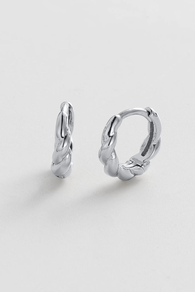 Marley Huggie - Silver-Zafino-The Marly Huggie features a softly sculpted braided design that adds subtle texture and dimension to a classic gold hoop. Its organic curves create a modern yet timeless look, making it an effortless addition to any jewellery collection. Designed to sit close to the ear, Marly is perfect for everyday wear or styled with other earrings for a layered, curated ear look. Metal: plated on brass base Dimensions: 11.45mm outer diameter, 7.7mm inner diameter + 3mm width Water Resistan