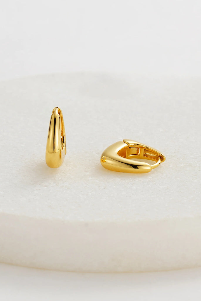 Neve huggy - Gold-Zafino-The Neve Huggie features a smooth curved design with a high-shine gold finish, making it a timeless everyday staple. Perfect for adding a touch of understated elegance to any look – wear solo or stack with your favourite hoops for a modern layered style. Metal: 18K Gold Plated on BrassDimensions: 8mm HoopWater Resistant: Splash proof, not recommended to be worn in the ocean or pool Water resistant Hypoallergenic & Nickel Free Female Founded & Family Owned-Pash + Evolve