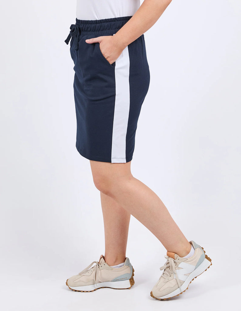Nico Fleece Skirt - Dark Sapphire-Elm-A cute little skirt that brings comfort in spades! Featuring a contrast colour side seam panel and pockets to hold your goodies, this skirt is so easy to style and wear on-the-go. Contrast colour side seam panels Pockets Elastic waist with drawcord French Terry Cotton Elastane Model is 171cm and wears Size 10-Pash + Evolve