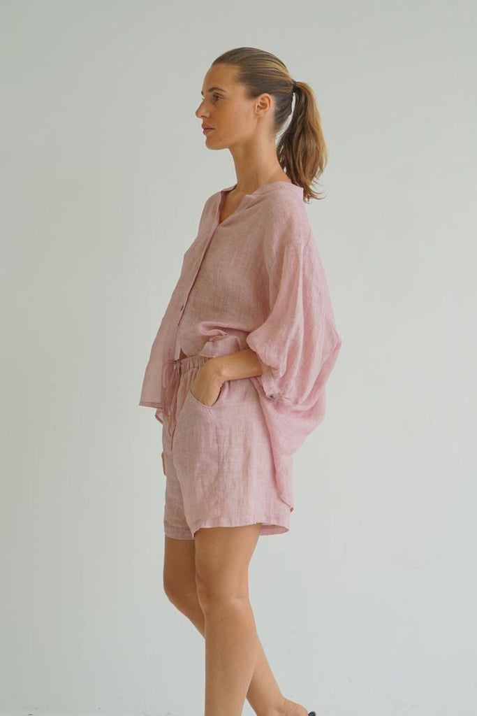 Nikola shirt - blush-Pash + Evolve-Nikola is always on Demand, in fact you will want to own her in every colour. This top is super easy to wear, and the most flattering fit on. Easily dress her up or down. * Button up front & back * Short sleeves * hi-low hemline * 100% Linen-Pash + Evolve