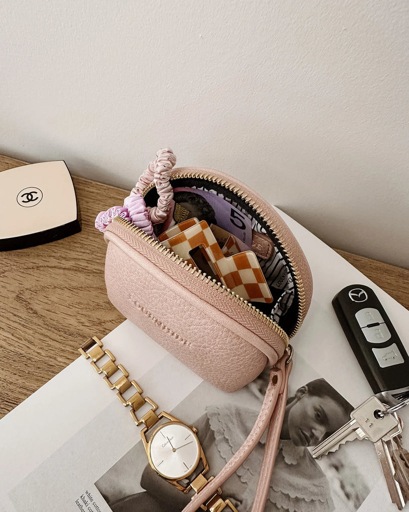 Paige purse - blush-Louenhide-The Louenhide Paige Blush Purse is the little essential you didn’t know your bag was missing. Designed with a compact round silhouette, this coin purse is perfect for keeping your valuables secure without taking up space. Whether it’s loose change, small essentials, or tiny treasures, this pouch slips effortlessly into any bag, ready to go wherever the day leads. Versatile yet refined, the Paige Blush Purse is a simple solution for staying organised. External Features Detachabl