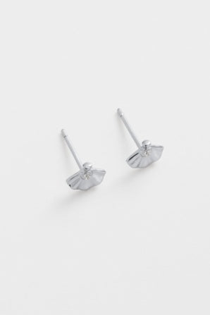 Paloma stud - silver-Zarla-A delicate stud with a softly sculpted shell-inspired form. Small yet light-catching, it brings a cool, luminous feel with a subtle coastal edge. Effortless, feminine, and easy to wear. *Rhodium Plated Solid Brass Base *Water proof: Can be worn in the ocean or pool-Pash + Evolve
