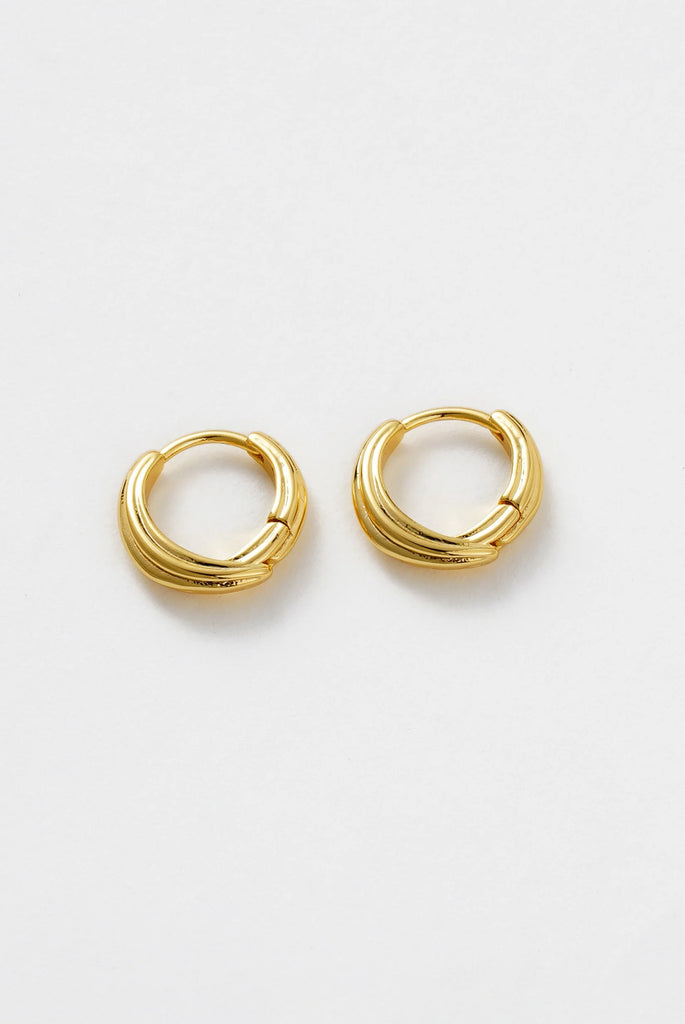 Paris Huggie - Gold-Zafino-Chic and versatile, the Paris Huggie is designed with a sleek layered finish that adds subtle dimension to your everyday style. Perfect on its own for a polished look, or styled with the matching Paris Hoop for a coordinated stack. A timeless piece that transitions seamlessly from day to night. Metal: 18K Gold Plated on BrassDimensions: 8mm HuggieWater Resistant: Splash proof, not recommended to be worn in the ocean or pool Water resistant Hypoallergenic & Nickel Free Female Found