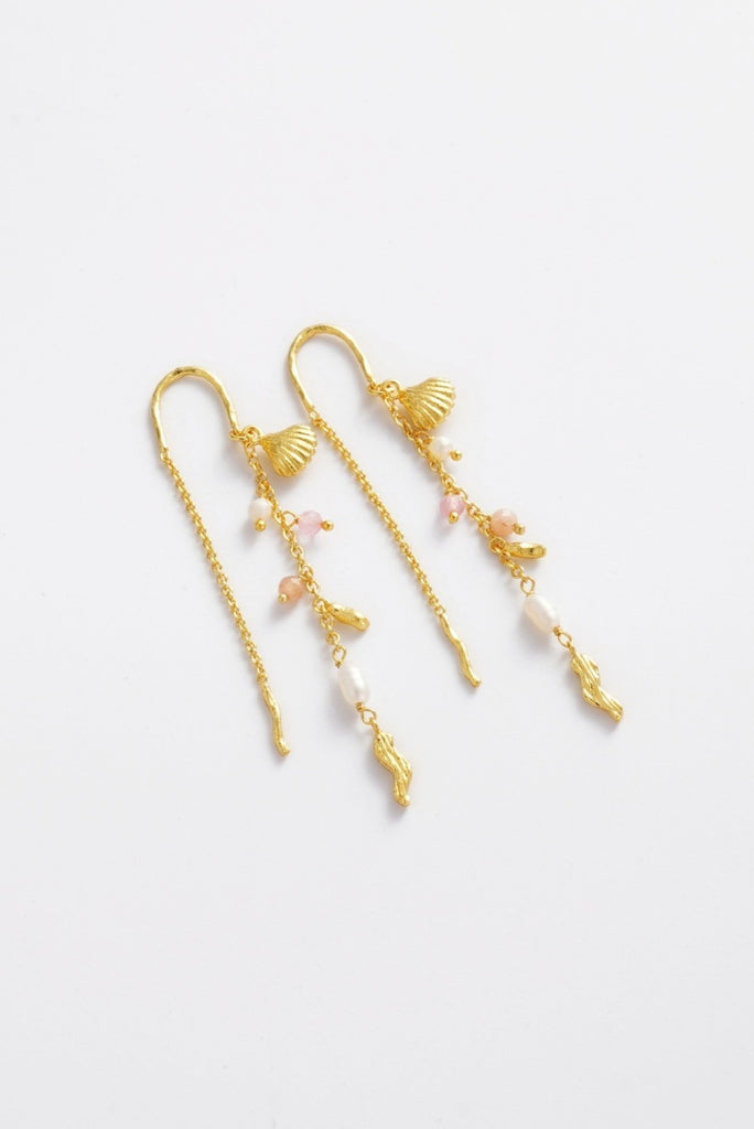 Poppy Thread Earring - Pastel-Zarla-A refined thread earring featuring soft pastel tones and delicate charms. Designed to move effortlessly with you, it catches the light with a subtle, beach-inspired elegance. Feminine, playful, and the perfect piece to elevate your everyday look. *18K Gold Plated Solid Brass *This piece is handmade and not recommended to be worn in water-Pash + Evolve