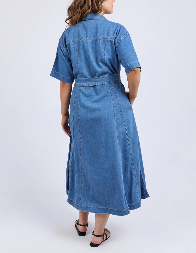River Denim Dress - Mid Blue Wash-Elm-The River Denim Dress is a lovely long-line dress with a tie waist and button through shirt style dress that looks just as great worn with some comfy sneakers as it does teamed with a sandal or boot. Versatility is key with this dress. Shirt dress style with self fabric waist tie Panel details at skirt Side seam pockets Rigid Denim Model is 171cm and wears Size 10-Pash + Evolve