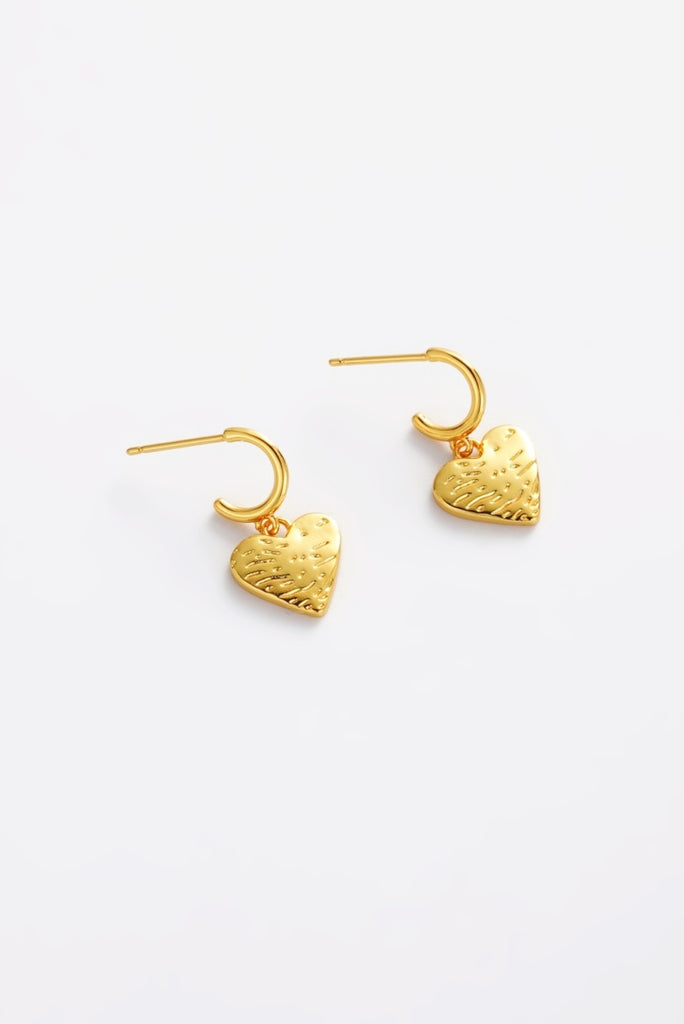 Romy hoop - gold-Zarla-A relaxed take on a classic hoop in a warm gold finish. The softly textured heart charm catches the light, adding an easy, sunlit glow to your look. Effortless, beachy, and made to be worn every day. *18K Gold Plated Solid Brass Base *Water proof: Can be worn in the ocean or pool-Pash + Evolve