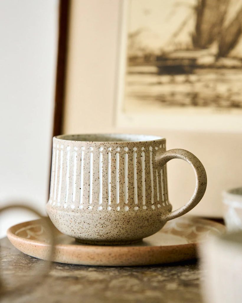 S/3 mugs - natural-Robert gordon-Natural Entertainer is designed for effortless hosting, with pieces that feel as grounding as they are beautiful. Made from unglazed speckled clay, each form is etched with subtle detail. The range is raw, tactile, and quietly refined. Set of 3 mugs with mixed designs Made from high fired stoneware Microwave & Dishwasher safe Earthy clay body with light organic glaze 345ml Designed in Australia-Pash + Evolve
