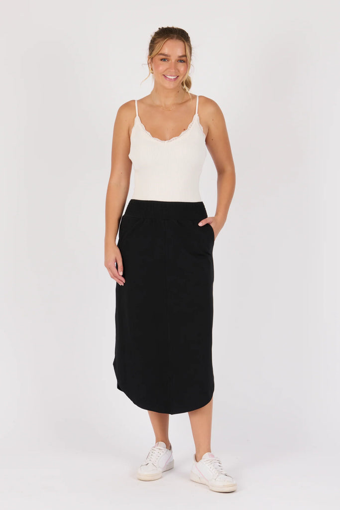 Scoop hem midi skirt - black-One Ten Willow-Shirred Elastic Waistband Scoop Hem Midi Length Side Seam Pockets Designed in Geelong Material: 95% Cotton 5% Elastane Model is 176cm (Size 8-10) and wears our size Small-Pash + Evolve