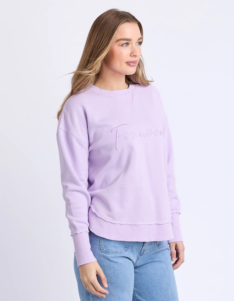 Signature Crew - Orchid-Foxwood-Our must-have Signature Crew is the perfect mix of comfort and style. Featuring classic Foxwood embroidery on the chest, this crew is all about the little details—think raw edge finishes and a flattering curved hemline. Designed for everyday ease, it’s your go-to layer for those laid-back, effortlessly cool looks. Front chest embroidery Raw edge detail Curved hem 100% Cotton Our model is 176cm and wears Size 10-Pash + Evolve