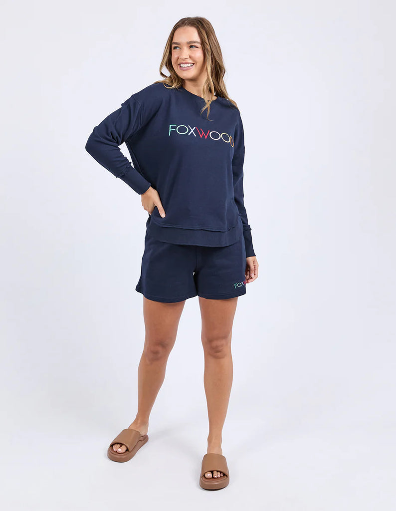 Simplified Confetti Crew - Navy-Foxwood-Say hello to your new feel-good fave. The Simplified Confetti Crew brings all the comfort with a playful twist. With multicoloured embroidery on the chest, raw edge details, and a curved hem that flatters every fit, it's the kind of piece you'll want to wear on repeat. Easy to throw on, even easier to love. One colour just won’t be enough. Front chest multicoloured embroidery Raw edge detail Curved hem 100% Cotton Model is wearing a size 10-Pash + Evolve