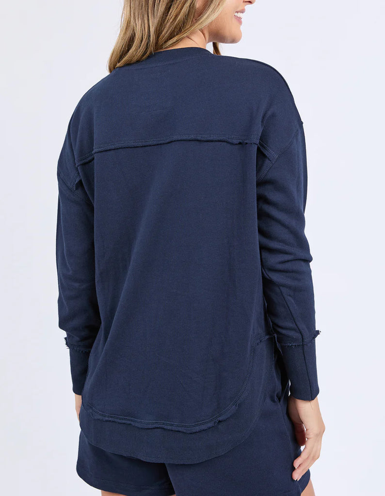 Simplified Confetti Crew - Navy-Foxwood-Say hello to your new feel-good fave. The Simplified Confetti Crew brings all the comfort with a playful twist. With multicoloured embroidery on the chest, raw edge details, and a curved hem that flatters every fit, it's the kind of piece you'll want to wear on repeat. Easy to throw on, even easier to love. One colour just won’t be enough. Front chest multicoloured embroidery Raw edge detail Curved hem 100% Cotton Model is wearing a size 10-Pash + Evolve