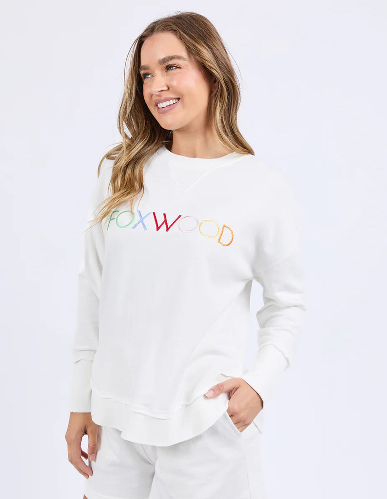 Simplified Confetti Crew - Vintage White-Foxwood-Say hello to your new feel-good fave. The Simplified Confetti Crew brings all the comfort with a playful twist. With multicoloured embroidery on the chest, raw edge details, and a curved hem that flatters every fit, it's the kind of piece you'll want to wear on repeat. Easy to throw on, even easier to love. One colour just won’t be enough. Front chest multicoloured embroidery Raw edge detail Curved hem 100% Cotton Model is wearing a size 10-Pash + Evolve