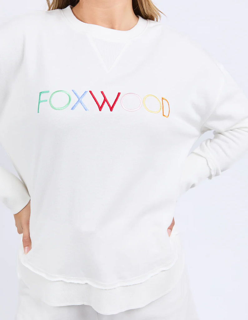 Simplified Confetti Crew - Vintage White-Foxwood-Say hello to your new feel-good fave. The Simplified Confetti Crew brings all the comfort with a playful twist. With multicoloured embroidery on the chest, raw edge details, and a curved hem that flatters every fit, it's the kind of piece you'll want to wear on repeat. Easy to throw on, even easier to love. One colour just won’t be enough. Front chest multicoloured embroidery Raw edge detail Curved hem 100% Cotton Model is wearing a size 10-Pash + Evolve