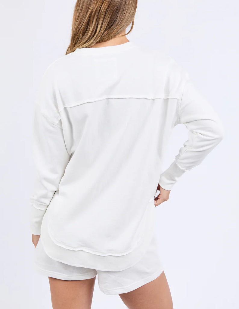 Simplified Confetti Crew - Vintage White-Foxwood-Say hello to your new feel-good fave. The Simplified Confetti Crew brings all the comfort with a playful twist. With multicoloured embroidery on the chest, raw edge details, and a curved hem that flatters every fit, it's the kind of piece you'll want to wear on repeat. Easy to throw on, even easier to love. One colour just won’t be enough. Front chest multicoloured embroidery Raw edge detail Curved hem 100% Cotton Model is wearing a size 10-Pash + Evolve