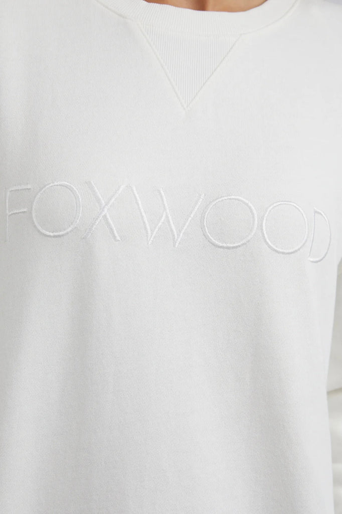 Simplified Crew - Ecru-Foxwood-The Simplified Crew is the perfect throw over for your everyday wardrobe. With its round neck, hi-lo hemline, side splits with raw edging & the classic Foxwood logo, you are going to want one in every colour. 100% UNBRUSHED COTTON FLEECE Our model wears size 10 Designed in Australia-Pash + Evolve