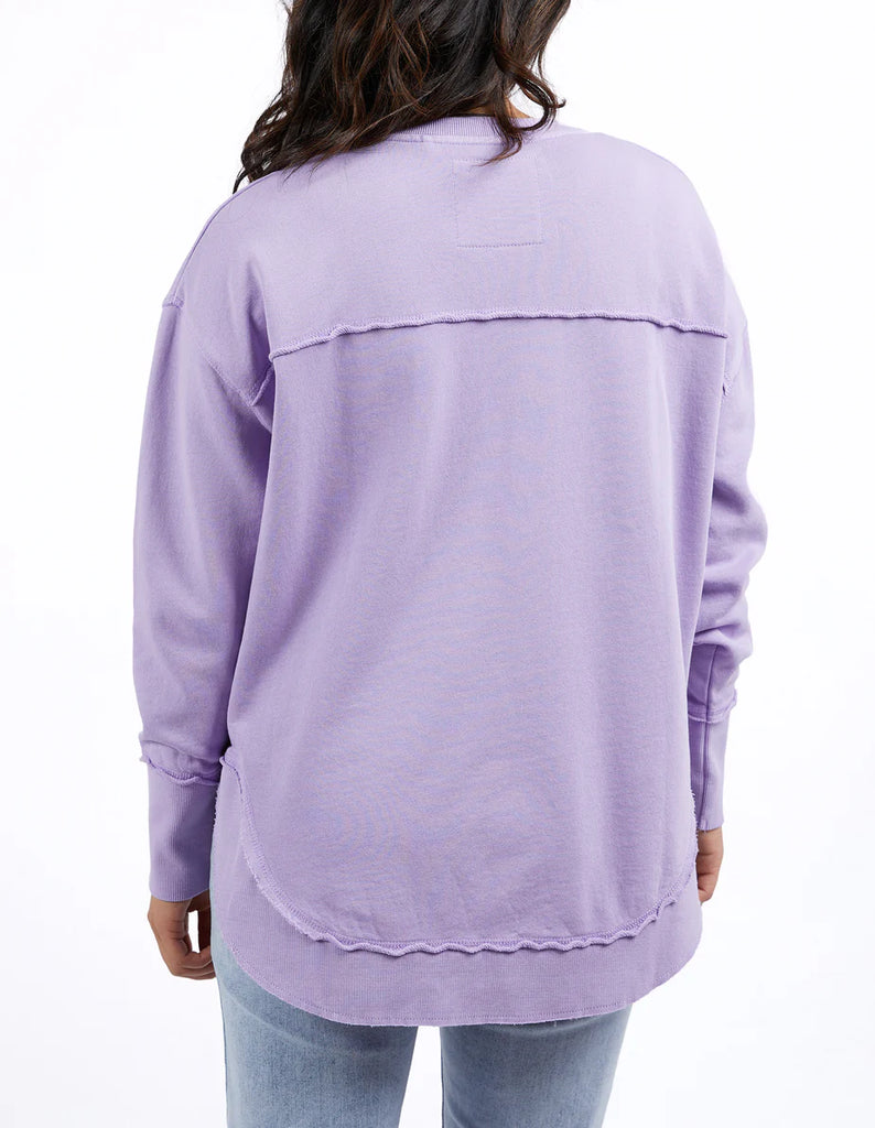 Simplified Crew - Lavender-Foxwood-The Simplified Crew is the perfect throw over for your everyday wardrobe. With its round neck, hi-lo hemline, side splits with raw edging & the classic Foxwood logo, you are going to want one in every colour. Front chest embroidery Raw edge detail Curved hem 100% Cotton Model is wearing a size 10-Pash + Evolve