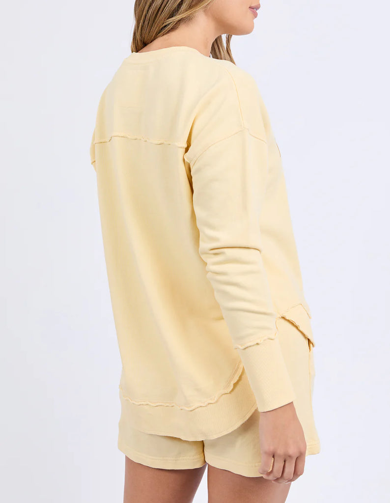 Simplified Crew - Lemon-Foxwood-The Simplified Crew is the perfect throw over for your everyday wardrobe. With its round neck, hi-lo hemline, side splits with raw edging & the classic Foxwood logo, you are going to want one in every colour. Front chest embroidery Raw edge detail Curved hem 100% Cotton Model is wearing a size 10-Pash + Evolve