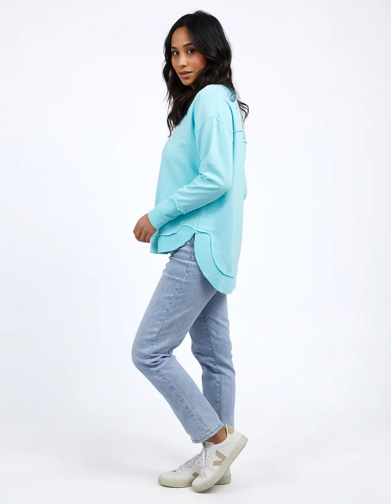 Simplified Crew - Light Blue-Foxwood-The Simplified Crew is the perfect throw over for your everyday wardrobe. With its round neck, hi-lo hemline, side splits with raw edging & the classic Foxwood logo, you are going to want one in every colour. Front chest embroidery Raw edge detail Curved hem 100% Cotton Our model is 176cm and wears Size 10-Pash + Evolve