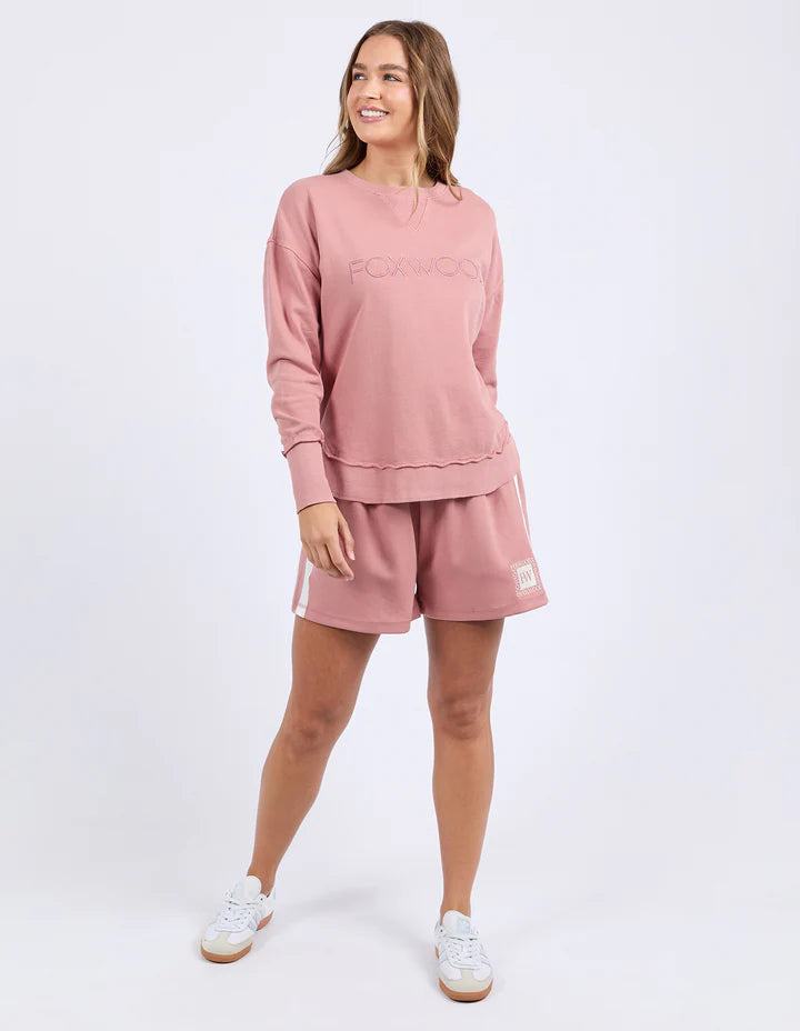 Simplified crew - dusty rose-Foxwood-The Simplified Crew is the perfect throw over for your everyday wardrobe. With its round neck, hi-lo hemline, side splits with raw edging & the classic Foxwood logo, you are going to want one in every colour. Front chest embroidery Raw edge detail Curved hem 100% Cotton Model is wearing size 10-Pash + Evolve